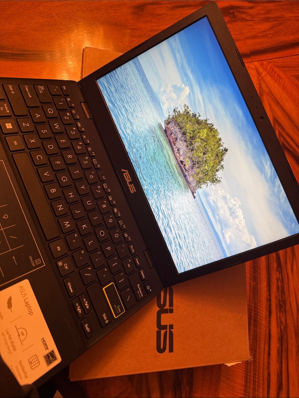 ASUS Black Laptop with Blue Display and Black Keyboard